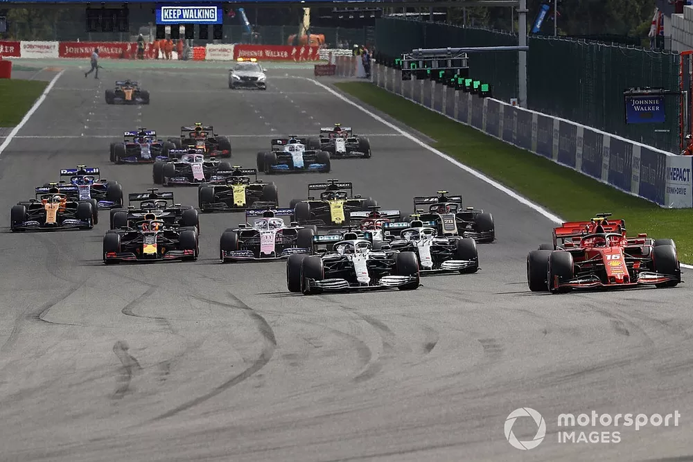 Charles Leclerc, Ferrari SF90, leads Sebastian Vettel, Ferrari SF90, Lewis Hamilton, Mercedes AMG F1 W10, Valtteri Bottas, Mercedes AMG W10, and the rest of the field at the start
