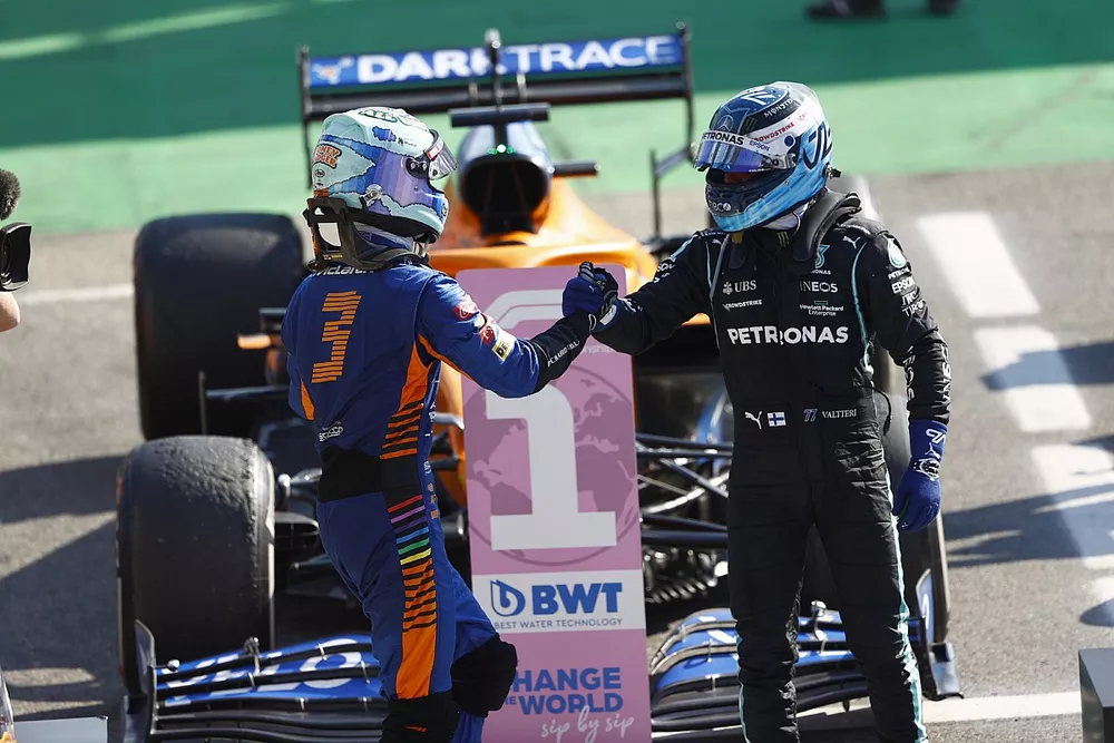 Daniel Ricciardo, McLaren, 1st position, and Valtteri Bottas, Mercedes, 3rd position, congratulate each other in Parc Ferme
