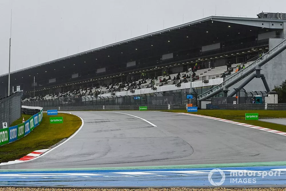 Fans wait out in the delay in the grandstand
