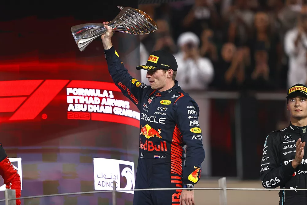 Max Verstappen, Red Bull Racing, 1st position, lifts his trophy on the podium