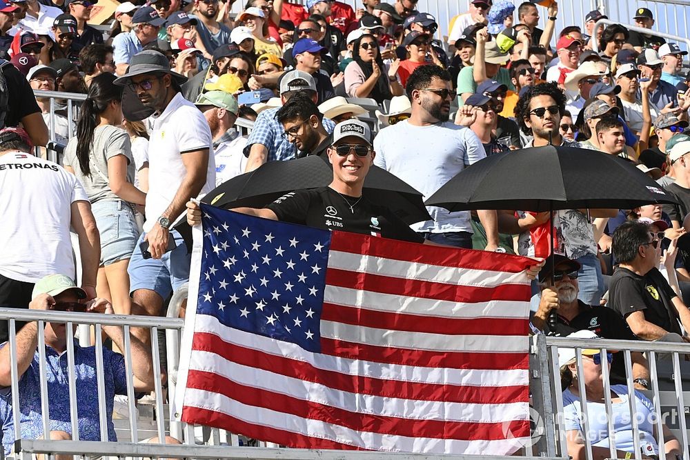 A fan with a US flag in a grandstand