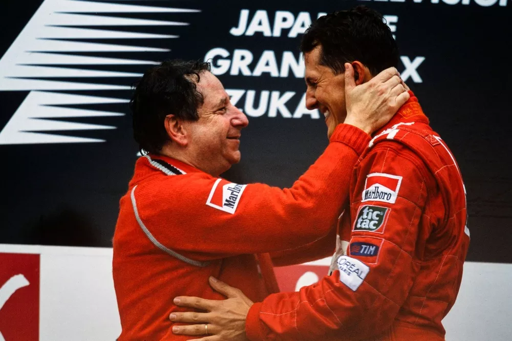 Jean Todt, Team Principal, Ferrari, and Michael Schumacher, 1st position, on the podium