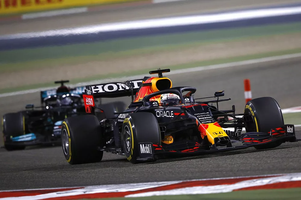 Max Verstappen, Red Bull Racing RB16B and Lewis Hamilton, Mercedes W12 