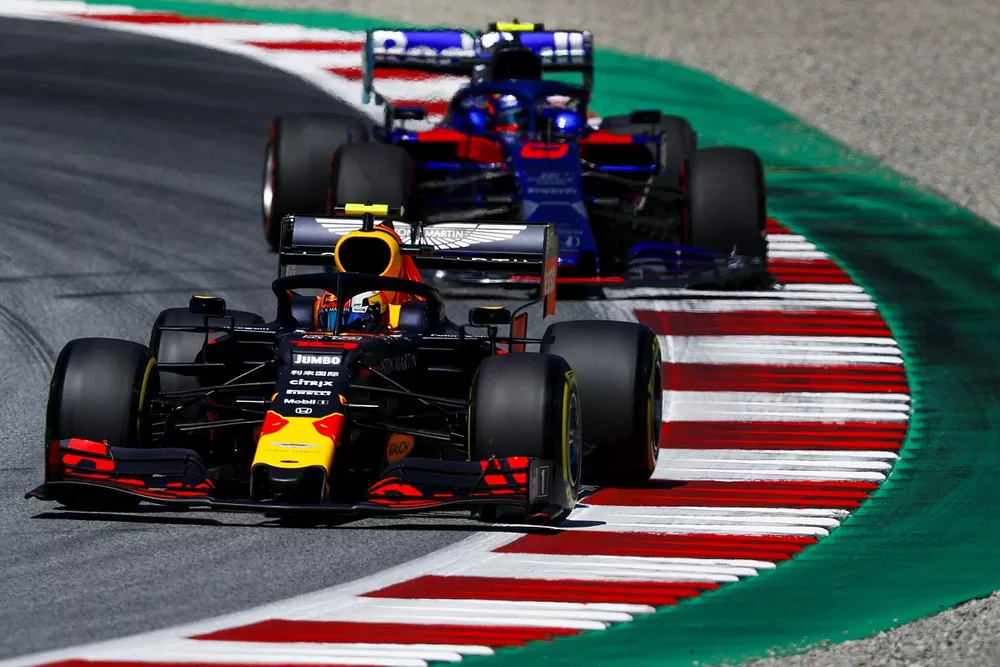Pierre Gasly, Red Bull Racing RB15, leads Alexander Albon, Toro Rosso STR14
