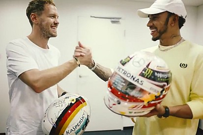 Vettel, Hamilton exchange helmets after F1 finale