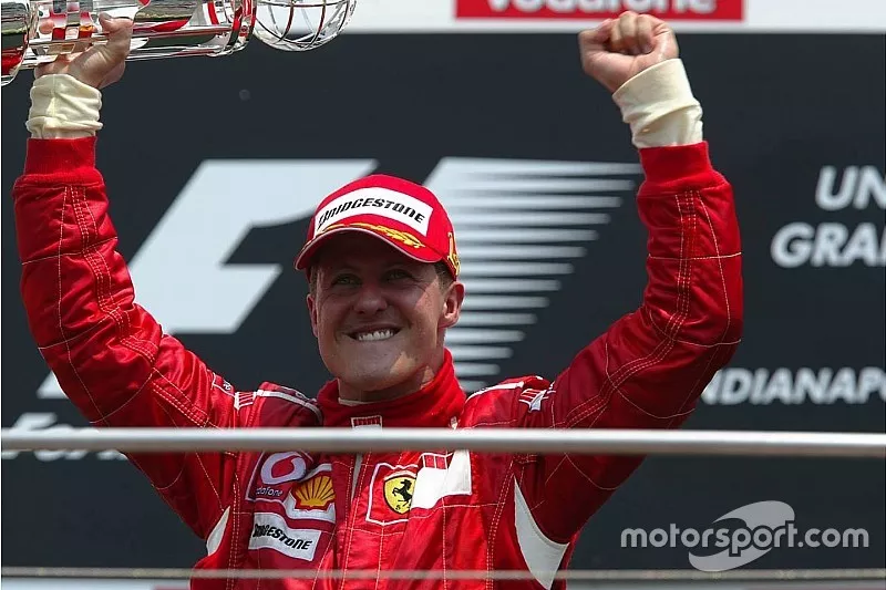 Podium: race winner Michael Schumacher celebrates