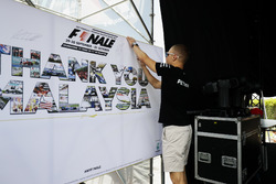 Valtteri Bottas, Mercedes AMG F1, puts his autograph on a wall on the F1 stage