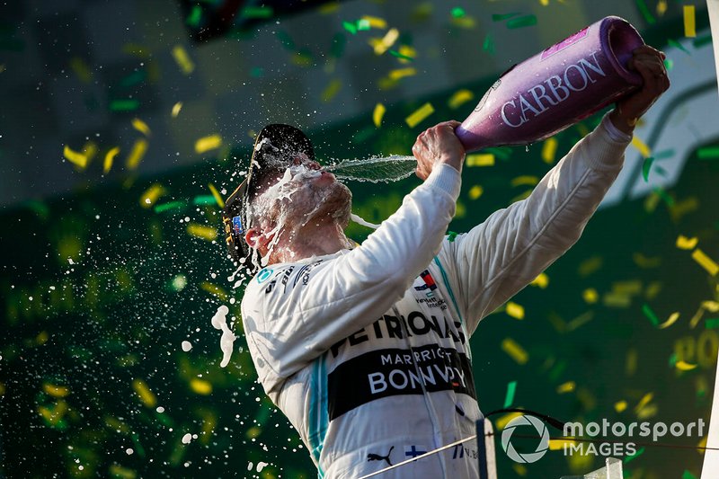 Valtteri Bottas, Mercedes AMG F1, 1st position, blasts himself with Champagne on the podium