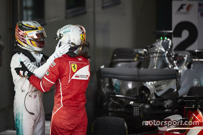 Sebastian Vettel, Ferrari, 1st Position, and Lewis Hamilton, Mercedes AMG, 2nd Position, congratulat