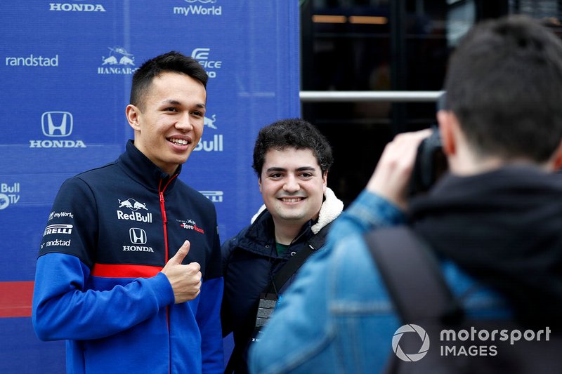 Alex Albon, Scuderia Toro Rosso poses for a photo with a fan