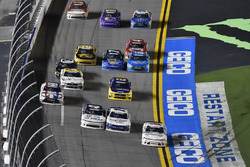 Justin Haley, GMS Racing, Chevrolet Camaro FOE passes Elliott Sadler, JR Motorsports, Chevrolet Camaro Chevrolet ARMOUR Chili and Kyle Larson, Chip Ganassi Racing, Chevrolet Camaro DC Solar under the yellow line