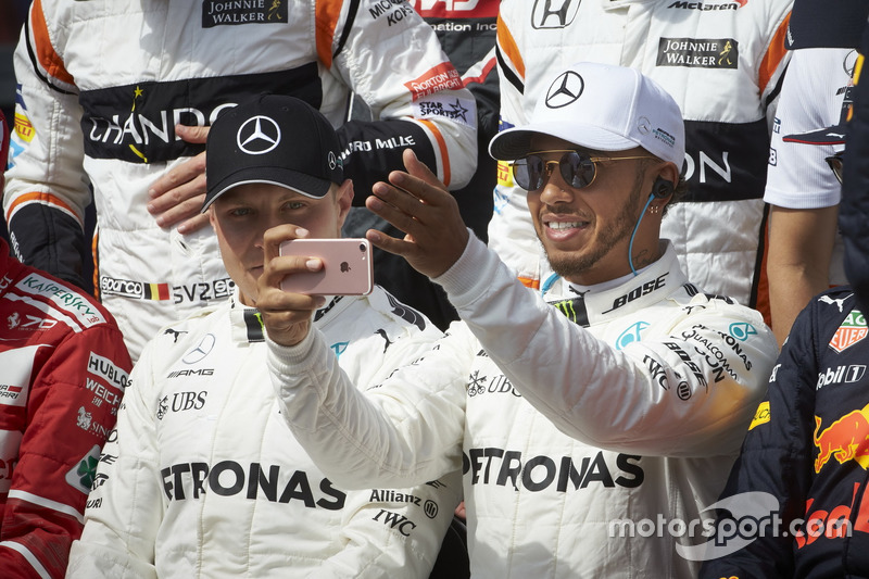 Lewis Hamilton, Mercedes AMG, takes a pic with team mate Valtteri Bottas, Mercedes AMG