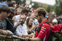 Sebastian Vettel, Ferrari signs autographs for the fans