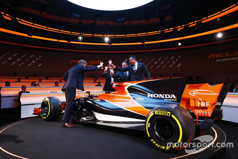 Yusuke Hasegawa, Senior Managing Officer, Honda, Zak Brown, Executive Director of McLaren Technology Group, Eric Boullier, Racing Director, McLaren, and presenter Simon Lazenby toast the McLaren MCL32