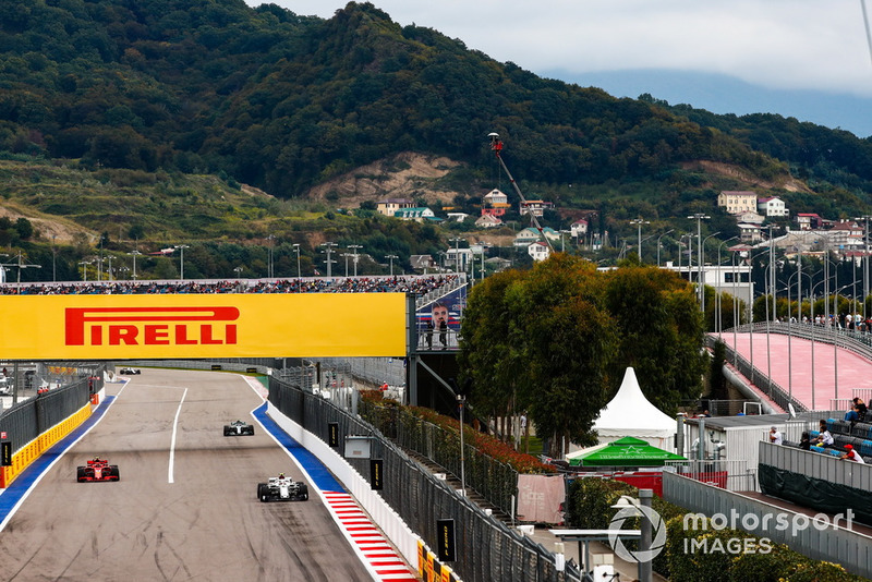 Charles Leclerc, Sauber C37, leads Kimi Raikkonen, Ferrari SF71H, and Valtteri Bottas, Mercedes AMG F1 W09