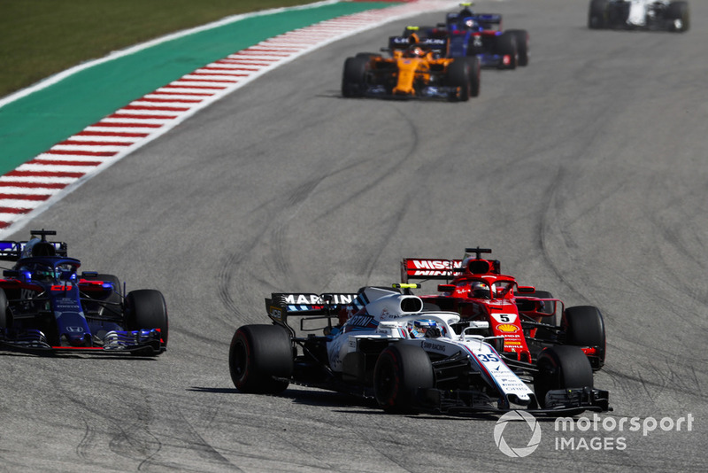 Sergey Sirotkin, Williams FW41, leads Sebastian Vettel, Ferrari SF71H, and Brendon Hartley, Toro Rosso STR13