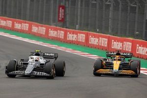 Yuki Tsunoda, AlphaTauri AT03, leads Daniel Ricciardo, McLaren MCL36
