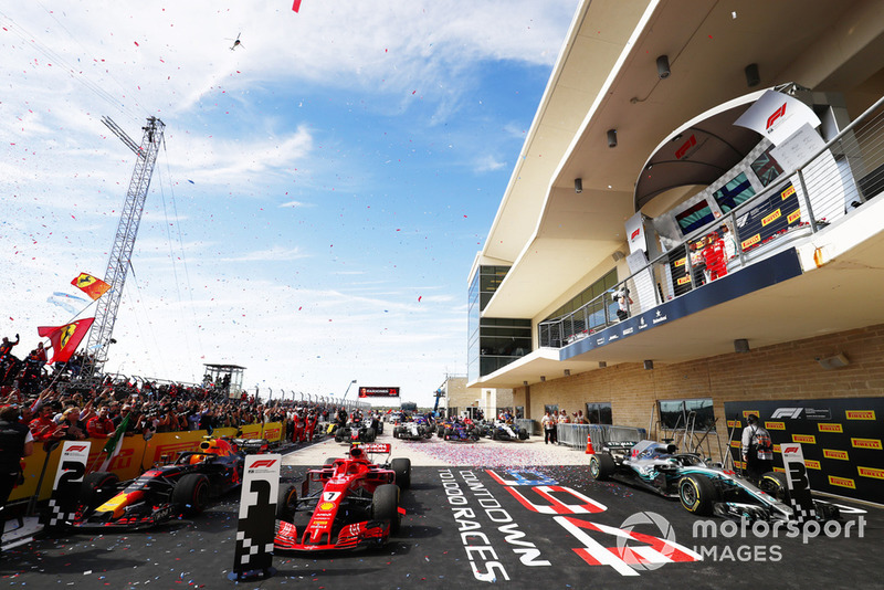 Kimi Raikkonen, Ferrari SF71H, festeggia sul podio con Max Verstappen, Red Bull Racing, e Lewis Hamilton, Mercedes AMG F1 W09 EQ Power+, dopo aver vinto la gara