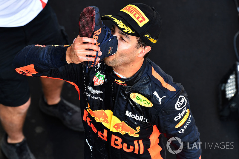 Race winner Daniel Ricciardo, Red Bull Racing celebrates with a shoey on the podium