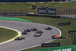 Daniel Ricciardo, Red Bull Racing RB13 and Stoffel Vandoorne, McLaren MCL32 collide at the start of the race
