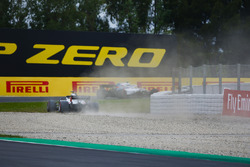 Romain Grosjean, Haas F1 Team VF-18, runs through a gravel trap after a misundrstanding with Sergey Sirotkin, Williams FW41