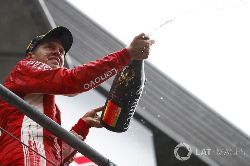 Winner Sebastian Vettel, Ferrari, celebrates on the podium
