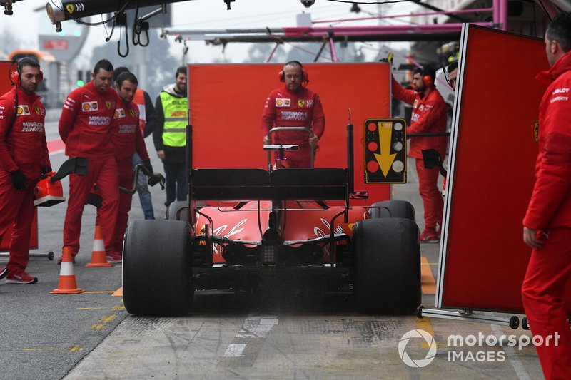 Sebastian Vettel, Ferrari SF90 and Ferrari mechanics with screens