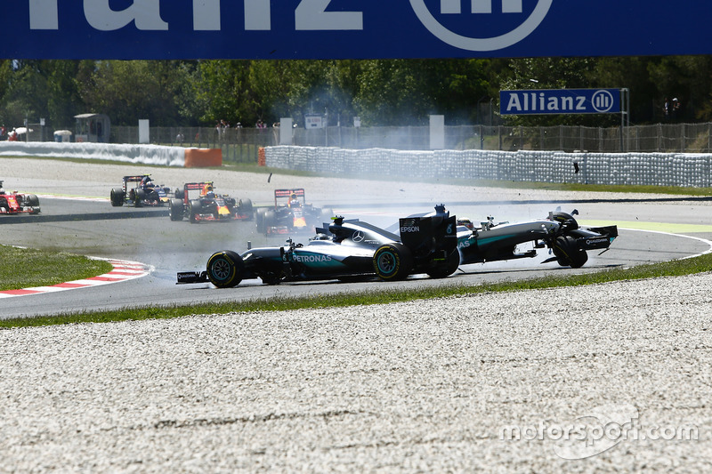 Lewis Hamilton, Mercedes AMG F1 W07 Hybrid and Nico Rosberg, Mercedes AMG F1 W07 Hybrid collide on the opening lap of the race