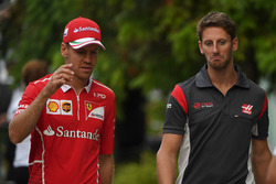 Sebastian Vettel, Ferrari and Romain Grosjean, Haas F1