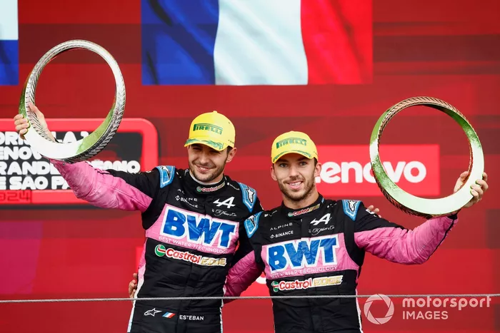 Esteban Ocon, Alpine F1 Team, 2nd position, Pierre Gasly, Alpine F1 Team, 3rd position, lift the trophy in celebration 
