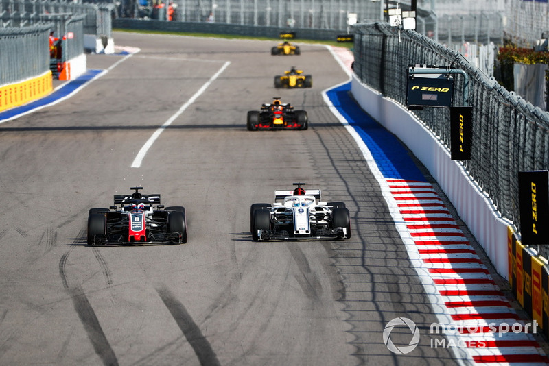 Romain Grosjean, Haas F1 Team VF-18, battles with Marcus Ericsson, Sauber C37