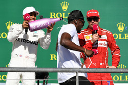 Race winner Lewis Hamilton, Mercedes AMG F1 celebrates on the podium with the champagne and Usain Bolt, third place Kimi Raikkonen, Ferrari