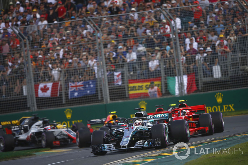 Lewis Hamilton, Mercedes AMG F1 W09, leads Kimi Raikkonen, Ferrari SF71H, Sebastian Vettel, Ferrari SF71H, Kevin Magnussen, Haas F1 Team VF-18 Ferrari, Max Verstappen, Red Bull Racing RB14 Tag Heuer, and the rest of the field at the start