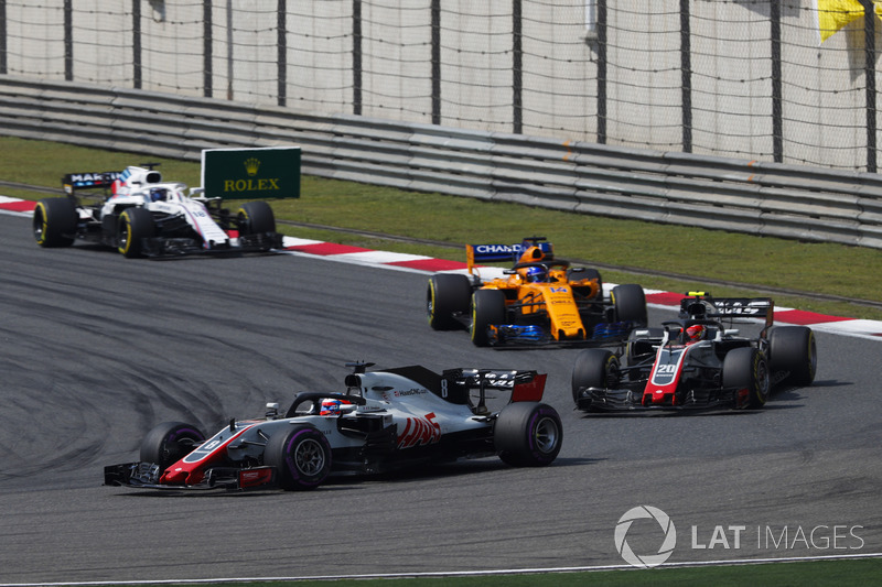 Romain Grosjean, Haas F1 Team VF-18 Ferrari, leads Kevin Magnussen, Haas F1 Team VF-18 Ferrari, and 