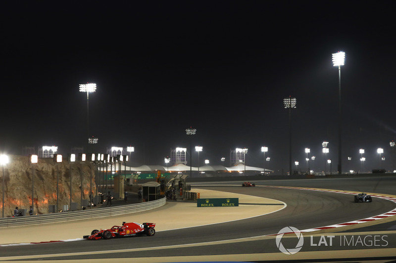 Sebastian Vettel, Ferrari SF71H, leads Valtteri Bottas, Mercedes AMG F1 W09, and Kimi Raikkonen, Ferrari SF71H