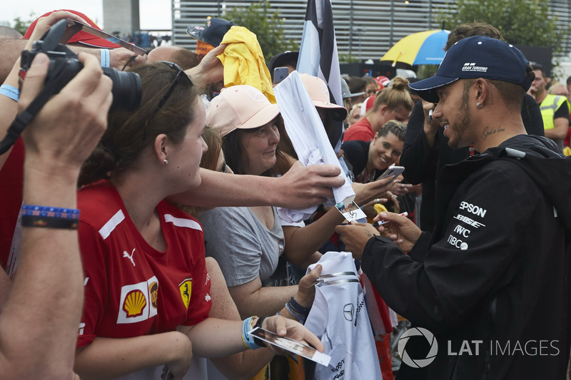 Lewis Hamilton, Mercedes AMG F1, signs autographs for fans