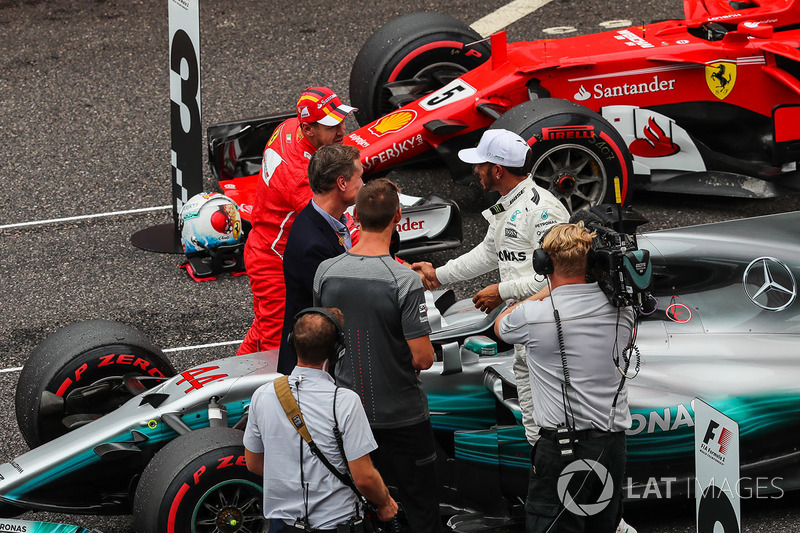 Sebastian Vettel, Ferrari and Lewis Hamilton, Mercedes AMG F1 celebrate in parc ferme alongside David Coulthard, Channel Four TV Commentator and Jenson Button (GBR)