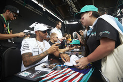 Lewis Hamilton, Mercedes AMG F1, signs autographs for fans