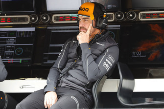 Fernando Alonso, McLaren, watches FP1 on the pit wall