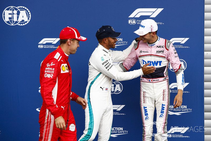 Sebastian Vettel, Ferrari, with Esteban Ocon, Racing Point Force India VJM1, and pole sitter Lewis Hamilton, Mercedes AMG F1
