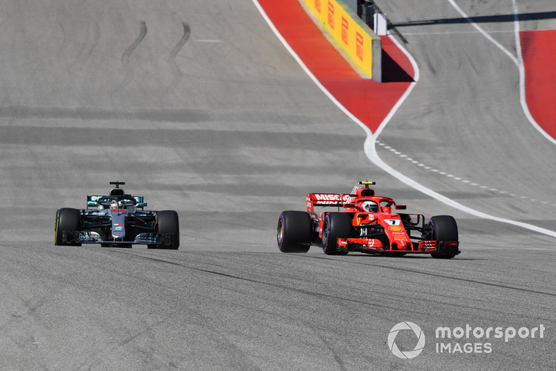 Kimi Raikkonen, Ferrari SF71H leads Lewis Hamilton, Mercedes-AMG F1 W09