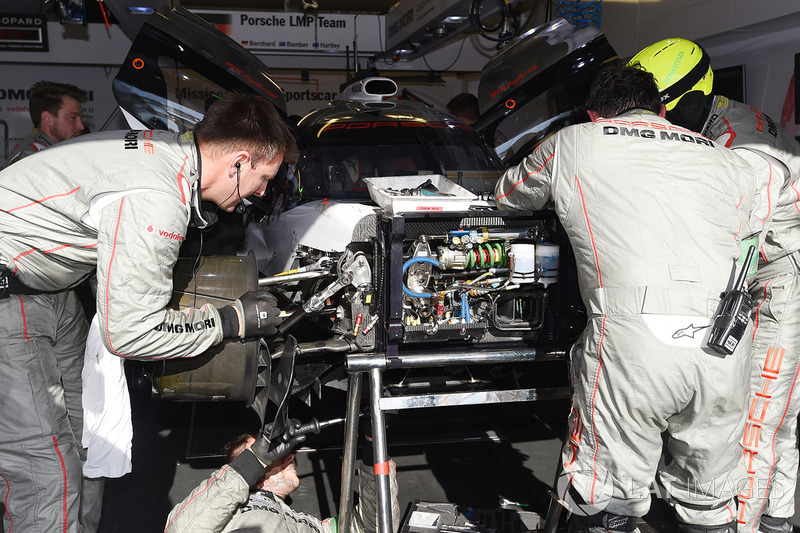 Crew members work on the #2 Porsche Team Porsche 919 Hybrid: Timo Bernhard, Earl Bamber, Brendon Har