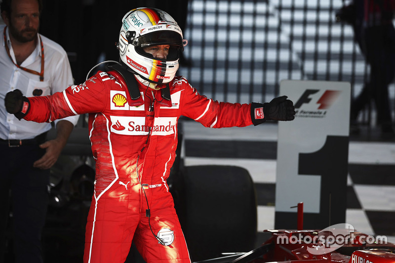 Sebastian Vettel, Ferrari, celebrates after winning the race