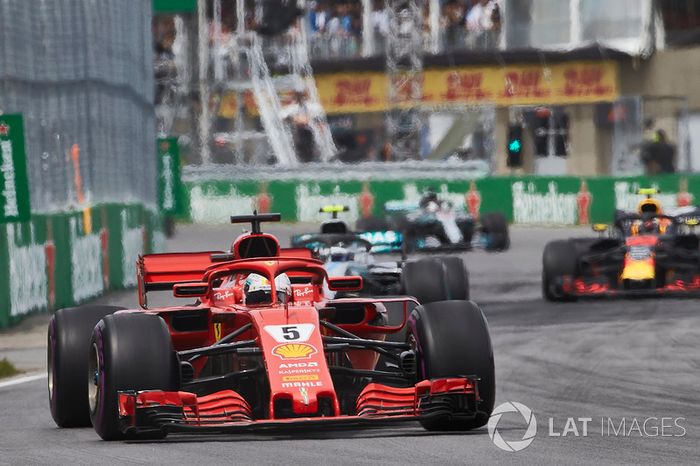 Sebastian Vettel, Ferrari SF71H, leads Valtteri Bottas, Mercedes AMG F1 W09