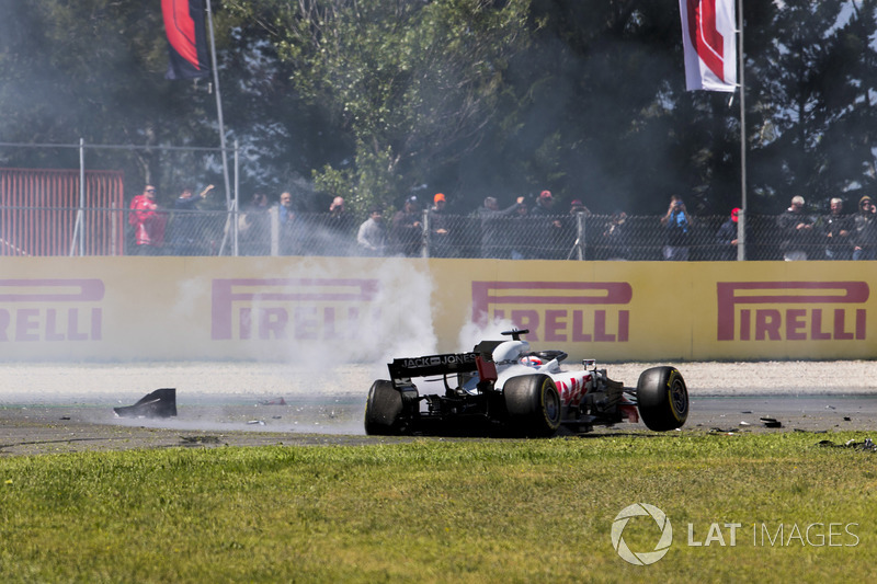 The damaged car of Romain Grosjean, Haas F1 Team VF-18, comes to a stop after his collision on lap 1