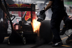 The brakes of Max Verstappen, Red Bull Racing RB12, catch fire in the pits