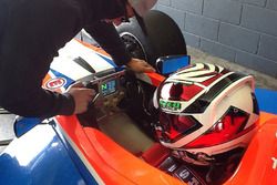 Tim Macrow runs through the MoTeC display with Anton De Pasquale as he prepares for his first run in the FT5000 car