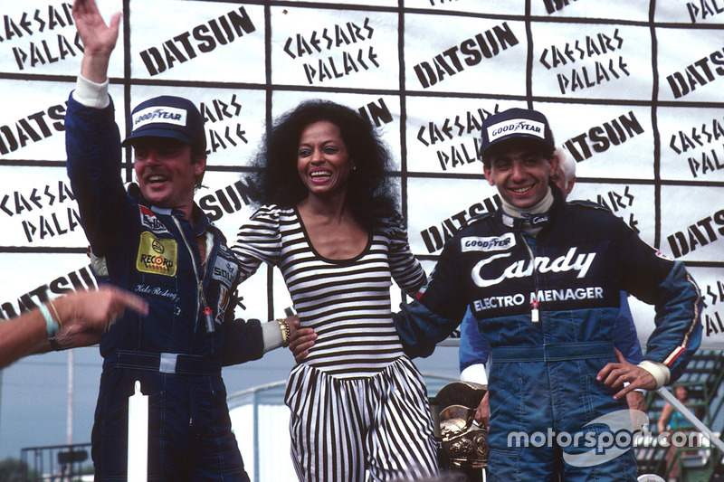 Podium: race winner Michele Alboreto, Tyrell Ford, World Champion Keke Rosberg, Williams Ford