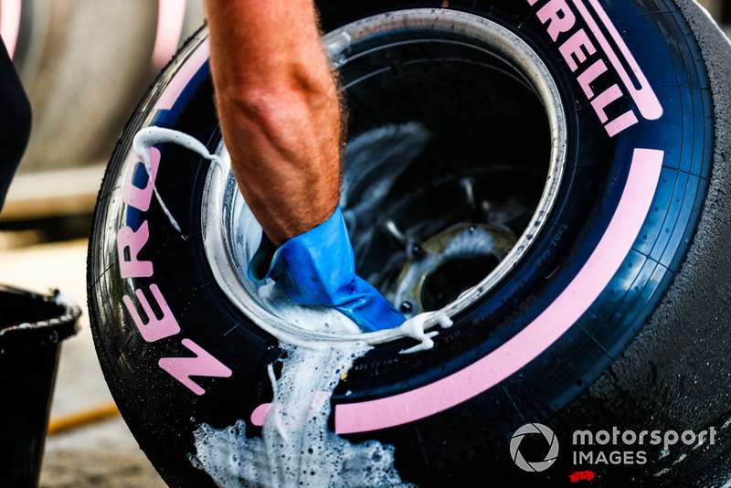 An engineer washes a Pirelli Hypersoft tyre