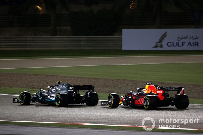 Valtteri Bottas, Mercedes AMG W10, leads Max Verstappen, Red Bull Racing RB15